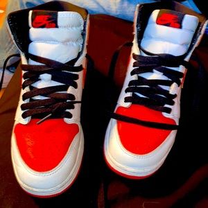 Red and white Jordan’s with black laces size 5.5 in women